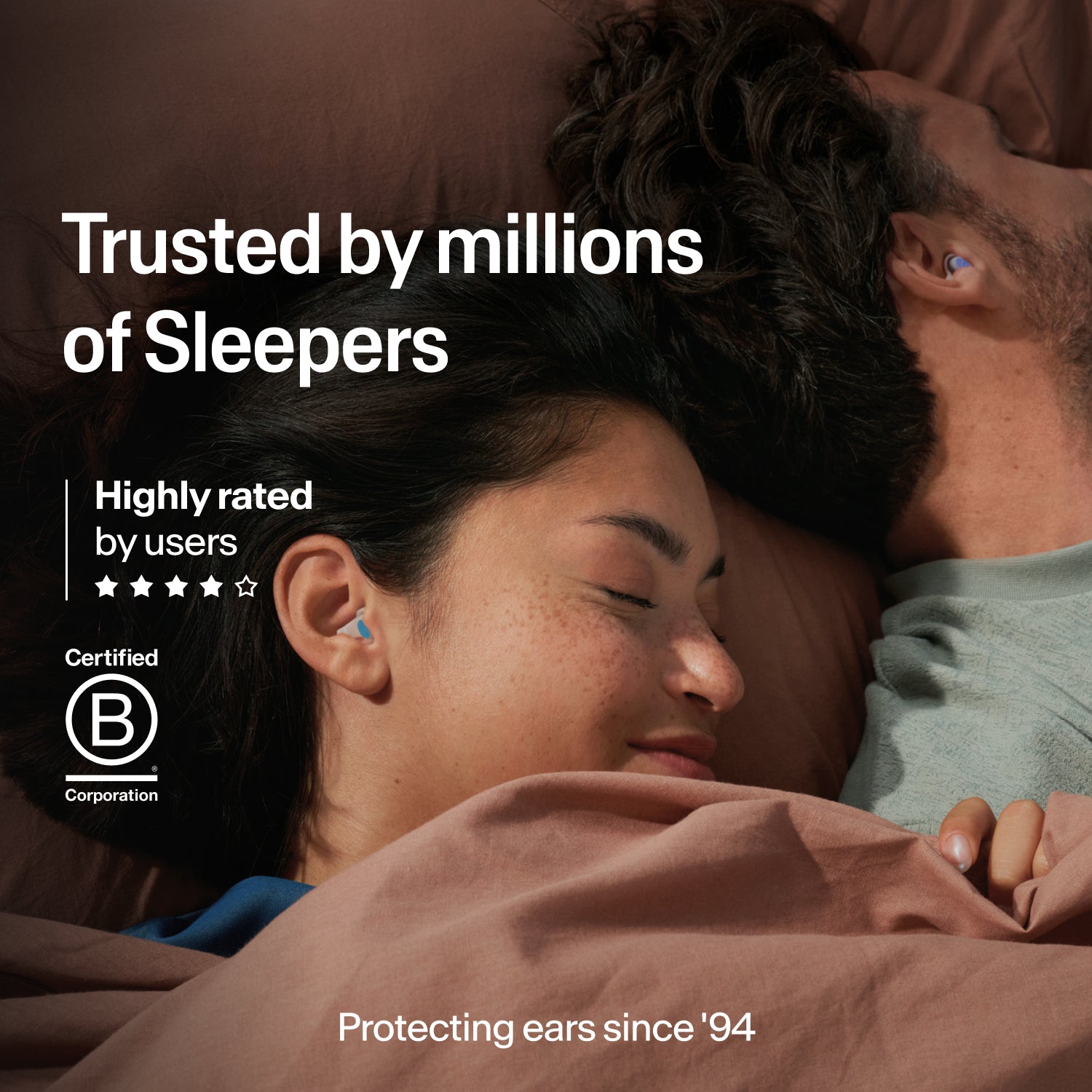Couple asleep wearing Alpine SleepDeep earplugs in size M, trusted by millions, B Corp certified and protecting ears since 1994
