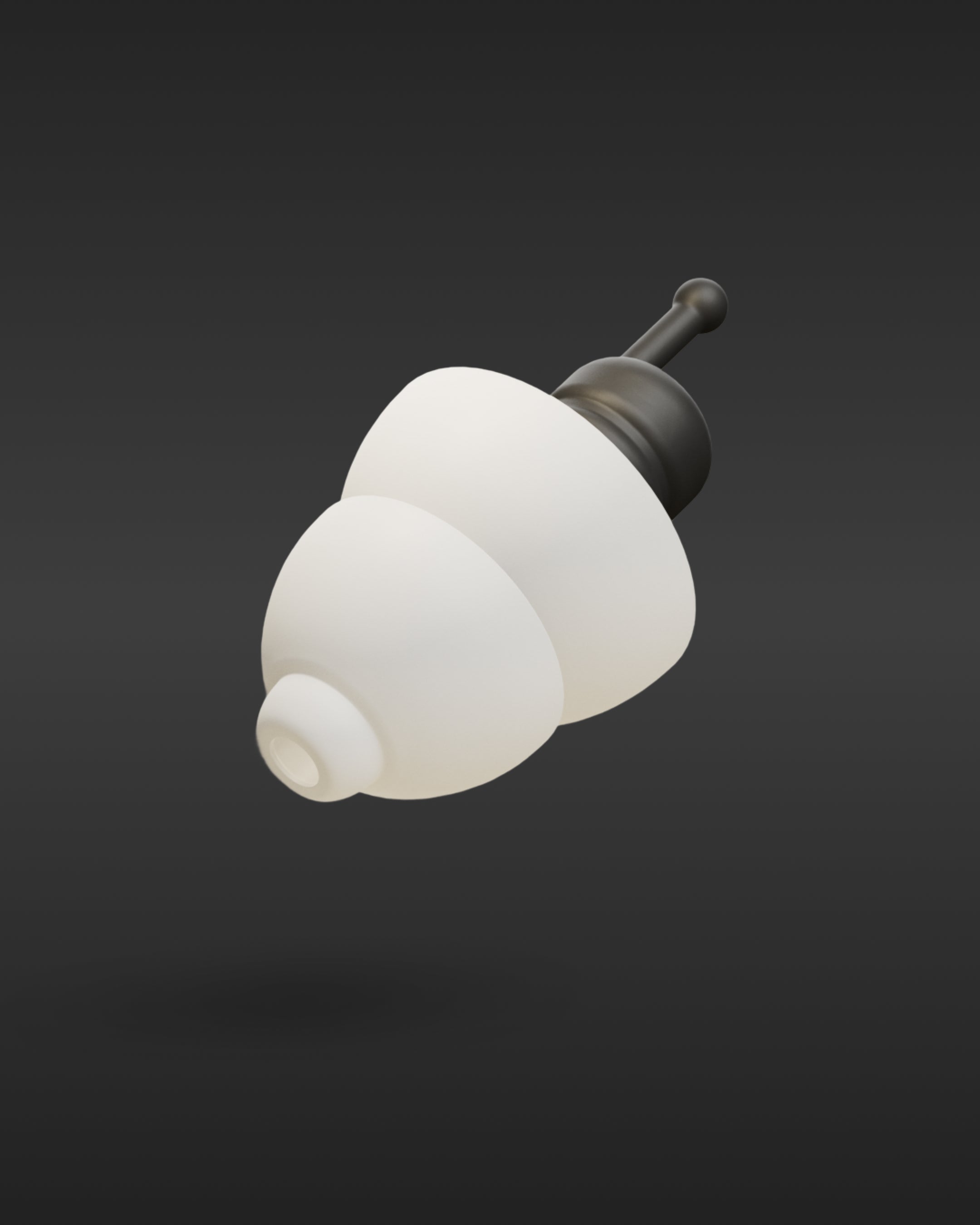 Single Alpine MotoSafe Tour earplug with white tips and black filter stem on a dark background 